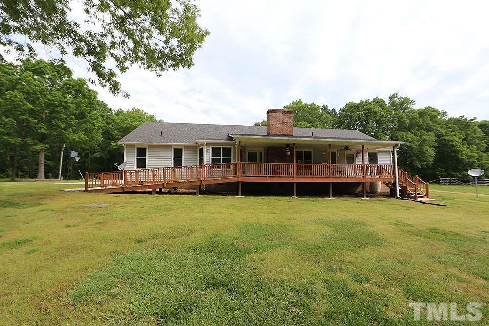 9808 Hampton Road Rougemont, NC 27572 - Photo 22 of 25 a view of a house with a backyard