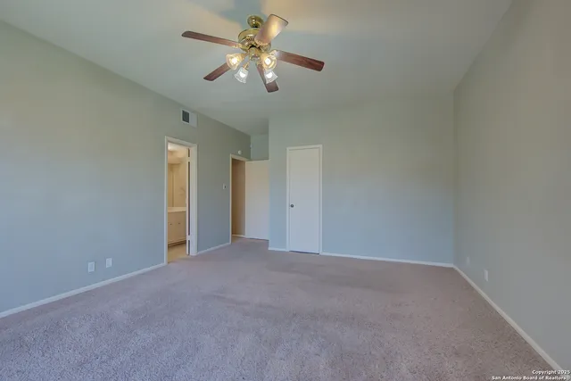 a bathroom with a sink shower and a mirror
