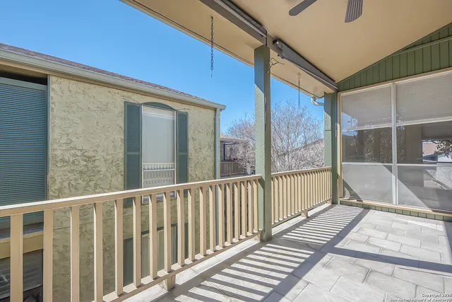 a view of a balcony with wooden floor and stairs