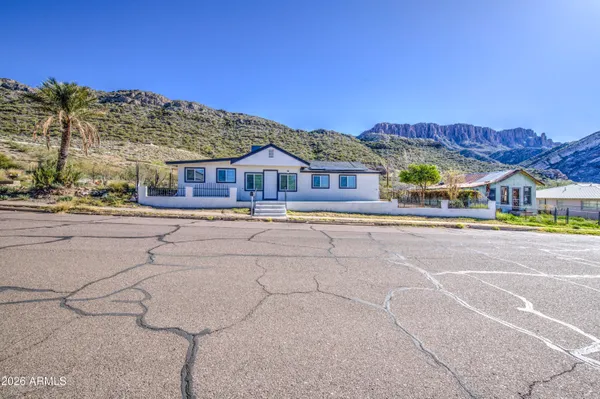 a view of multiple houses with a street