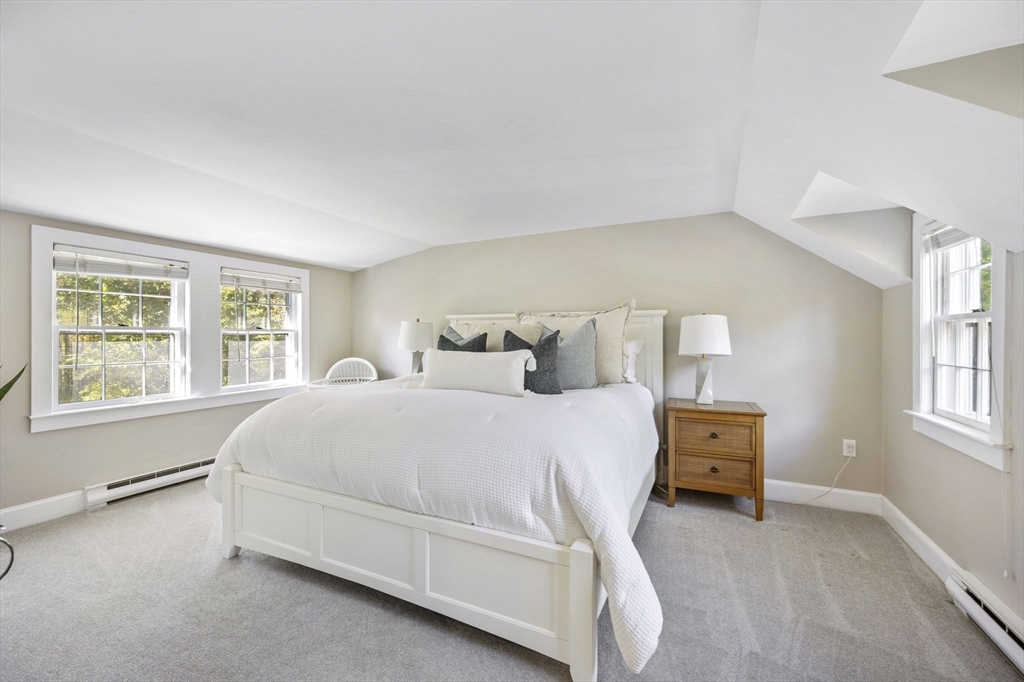 216 Whiting Street Hanover, MA 02339 - Photo 11 of 21 a spacious bedroom with a bed and a window