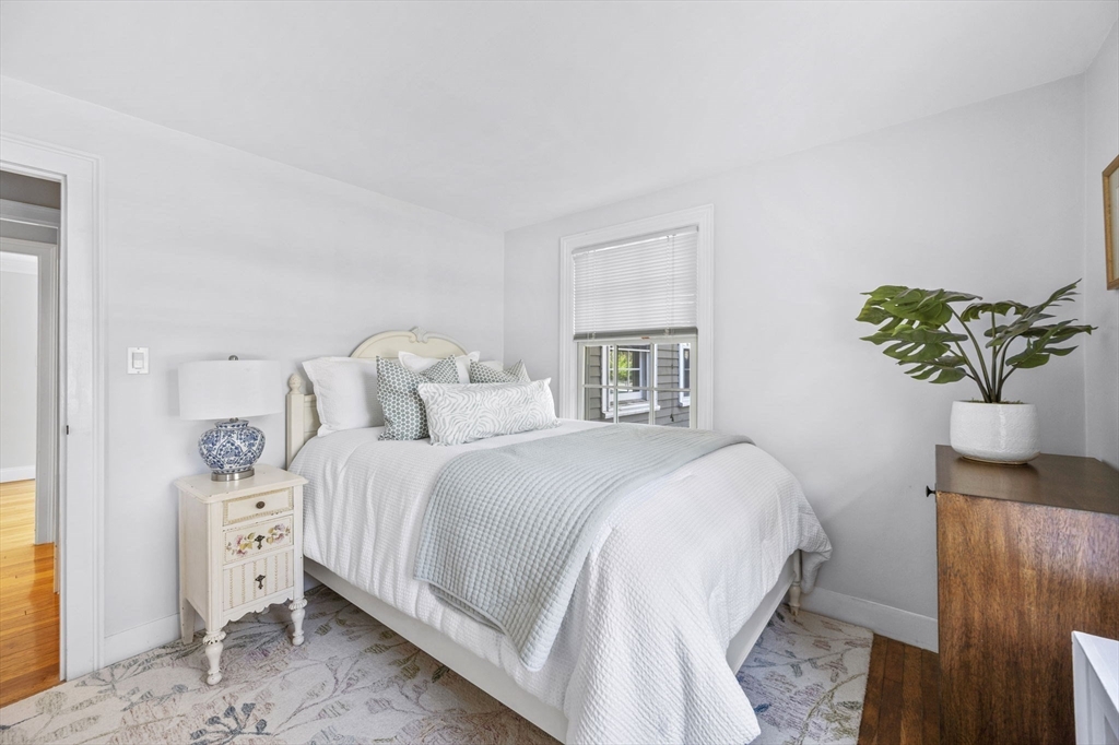 216 Whiting Street Hanover, MA 02339 - Photo 14 of 21 a bedroom with bed and window