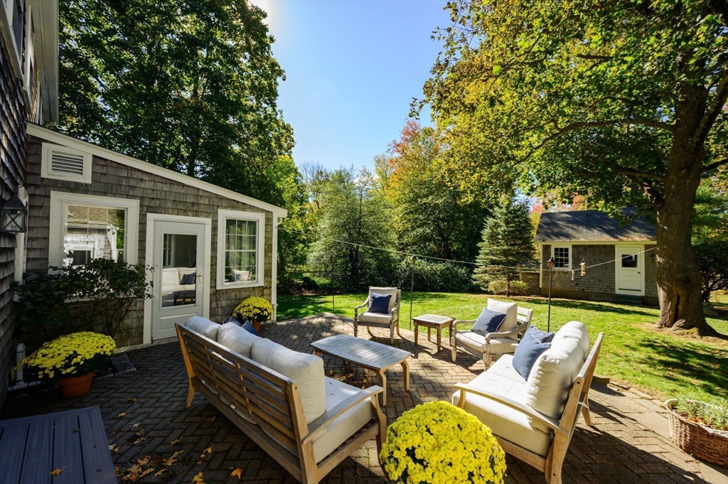 216 Whiting Street Hanover, MA 02339 - Photo 16 of 21 a view of a patio with couches chairs and a fire pit