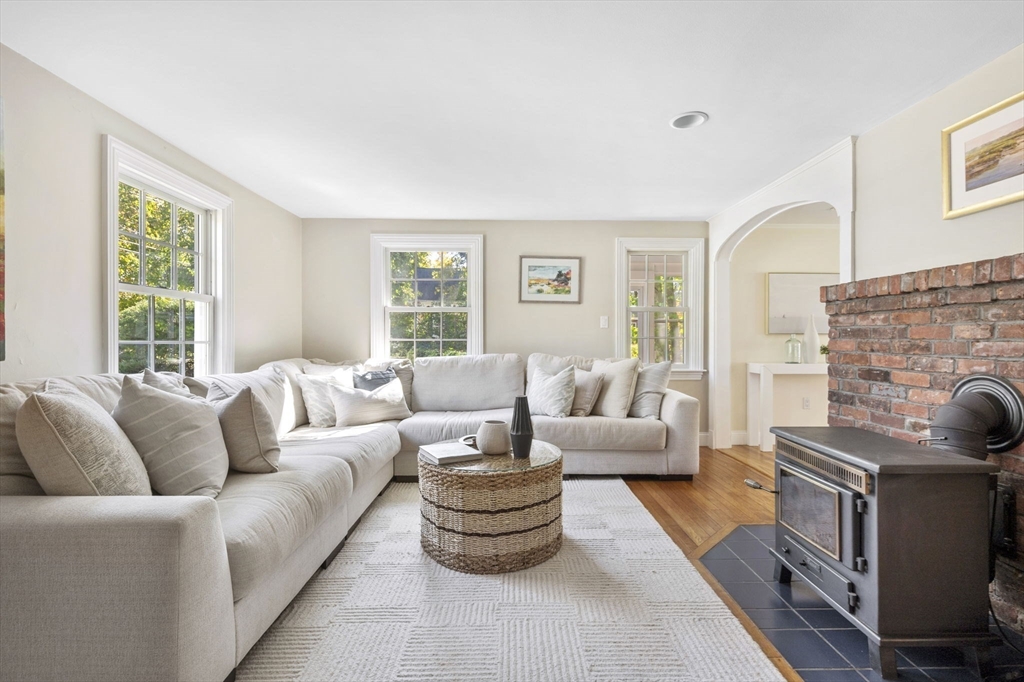 216 Whiting Street Hanover, MA 02339 - Photo 9 of 21 a living room with furniture and a fireplace