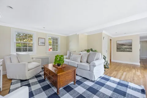 a living room with furniture and windows