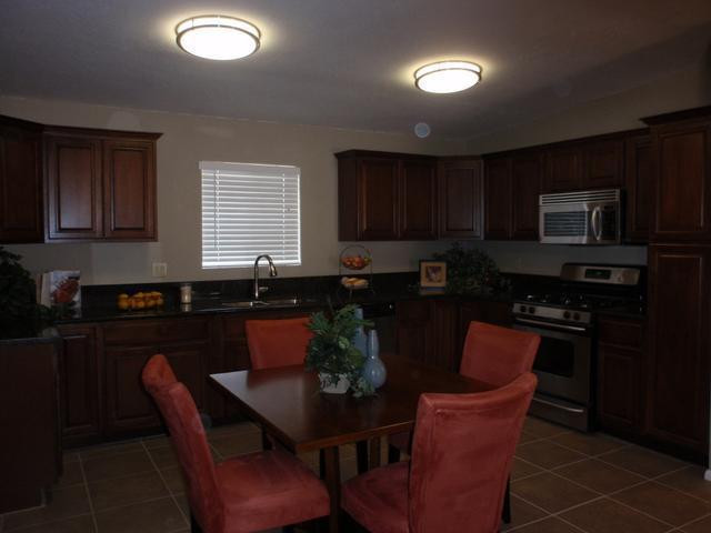 420 East Garfield Street Tempe, AZ 85288 - Photo 4 of 7 a kitchen with granite countertop furniture a sink stainless steel appliances and cabinets