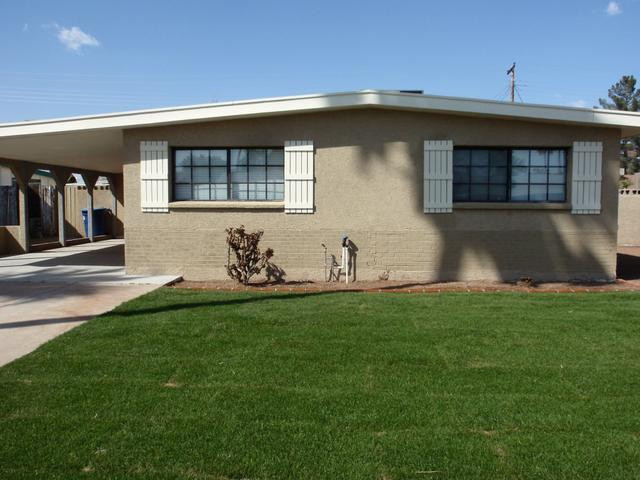 420 East Garfield Street Tempe, AZ 85288 - Photo 7 of 7 a front view of a house with garden