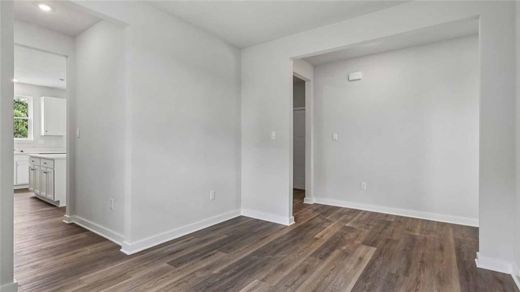 1099 Peachtree Road Carnegie, PA 15106 - Photo 12 of 25 a view of an empty room with wooden floor and a window