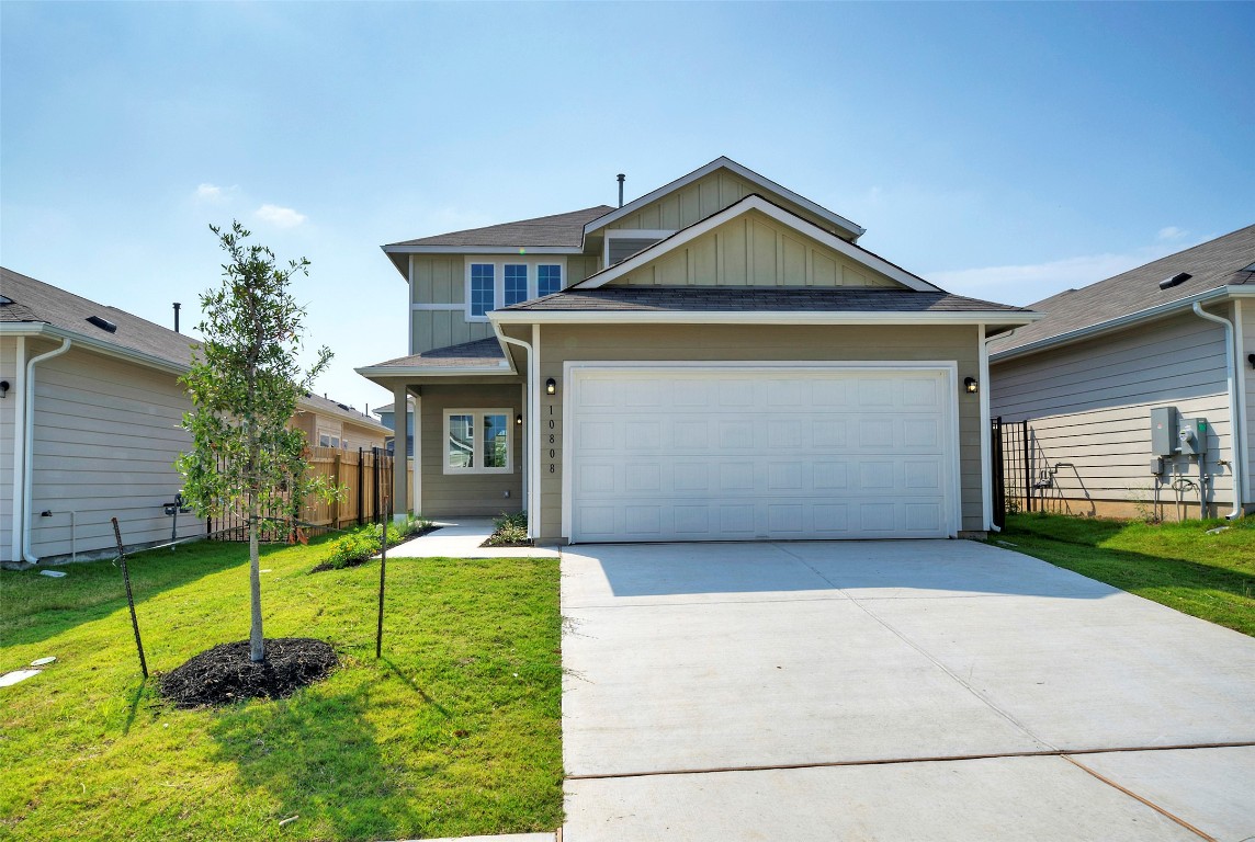 10808 Timber Brook Pass Austin, TX 78747 - Photo 1 of 1 a front view of a house with a yard and garage
