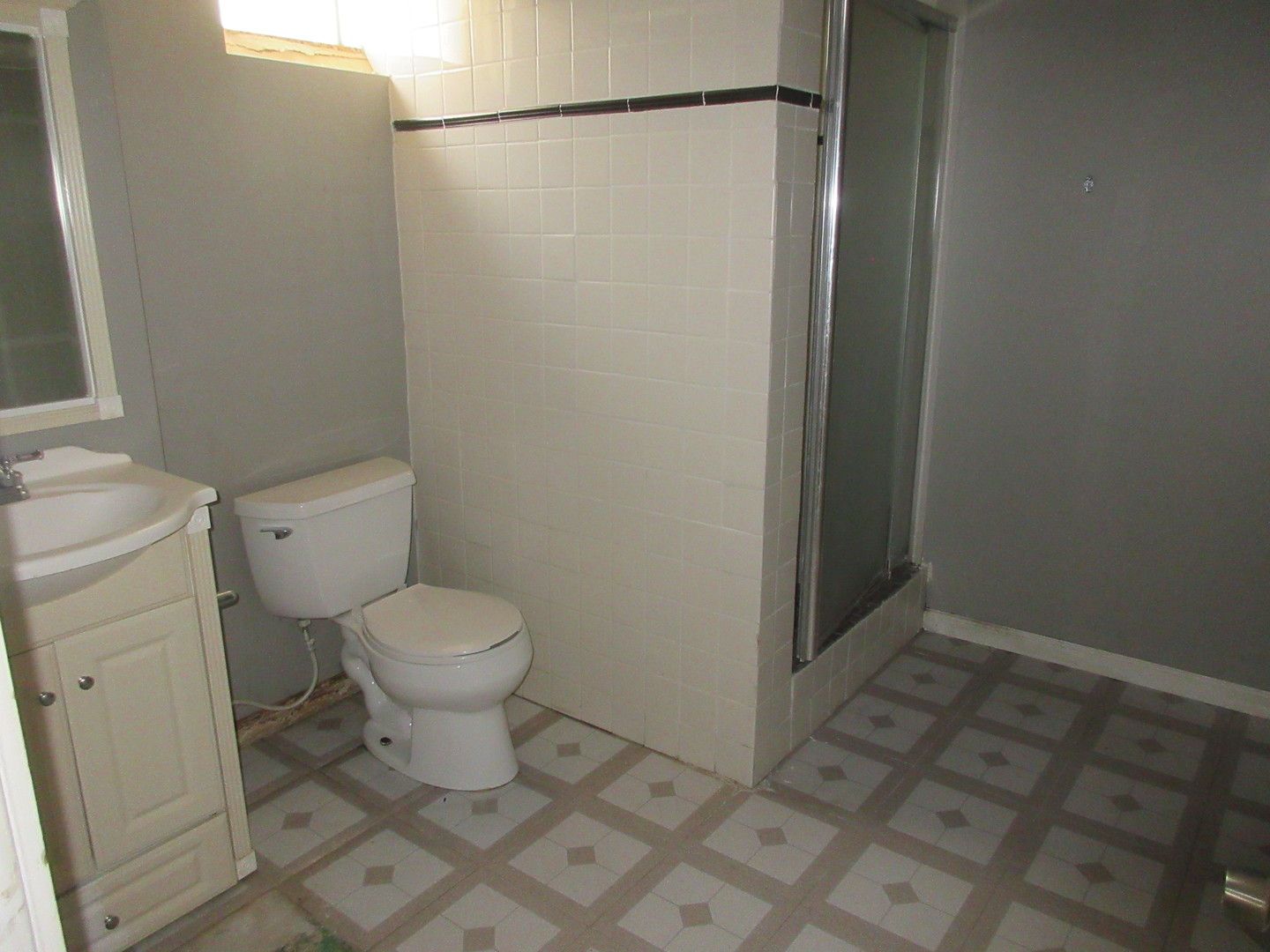 308 West Grove Road Sterling, IL 61081 - Photo 29 of 35 a bathroom with a toilet and a shower