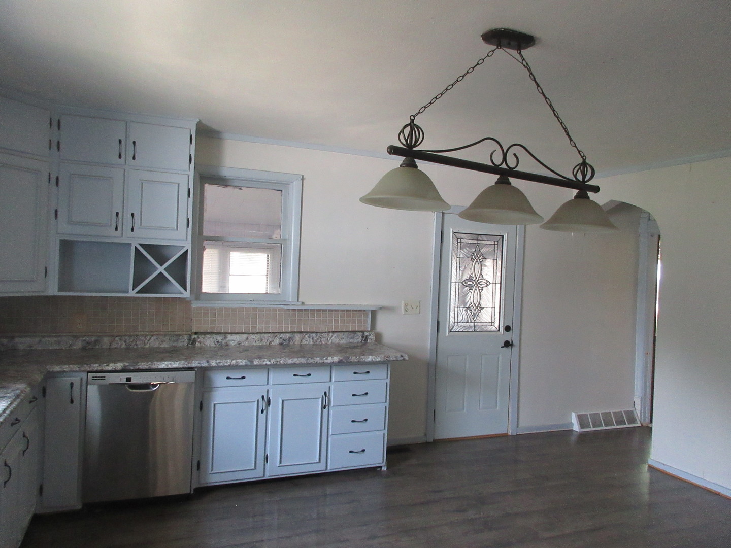 308 West Grove Road Sterling, IL 61081 - Photo 7 of 35 a kitchen with granite countertop a sink stainless steel appliances and cabinets
