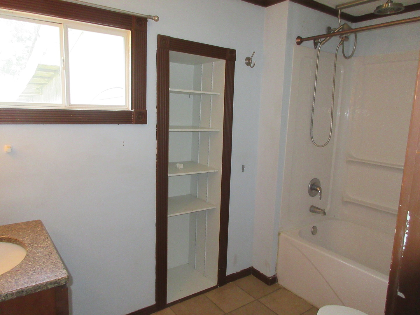 308 West Grove Road Sterling, IL 61081 - Photo 9 of 35 a bathroom with a bath tub and a shower