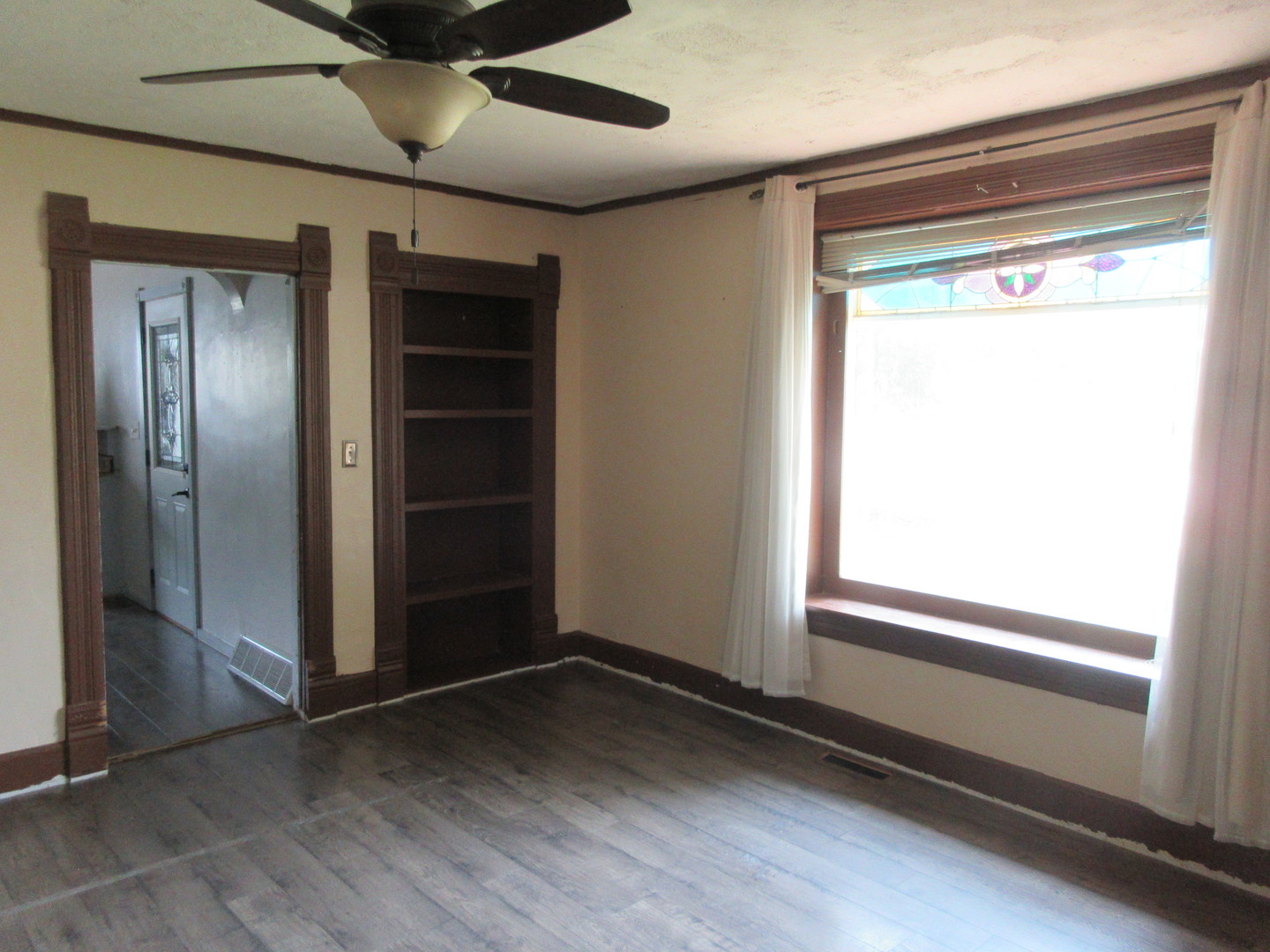 308 West Grove Road Sterling, IL 61081 - Photo 10 of 35 a view of an empty room with a window