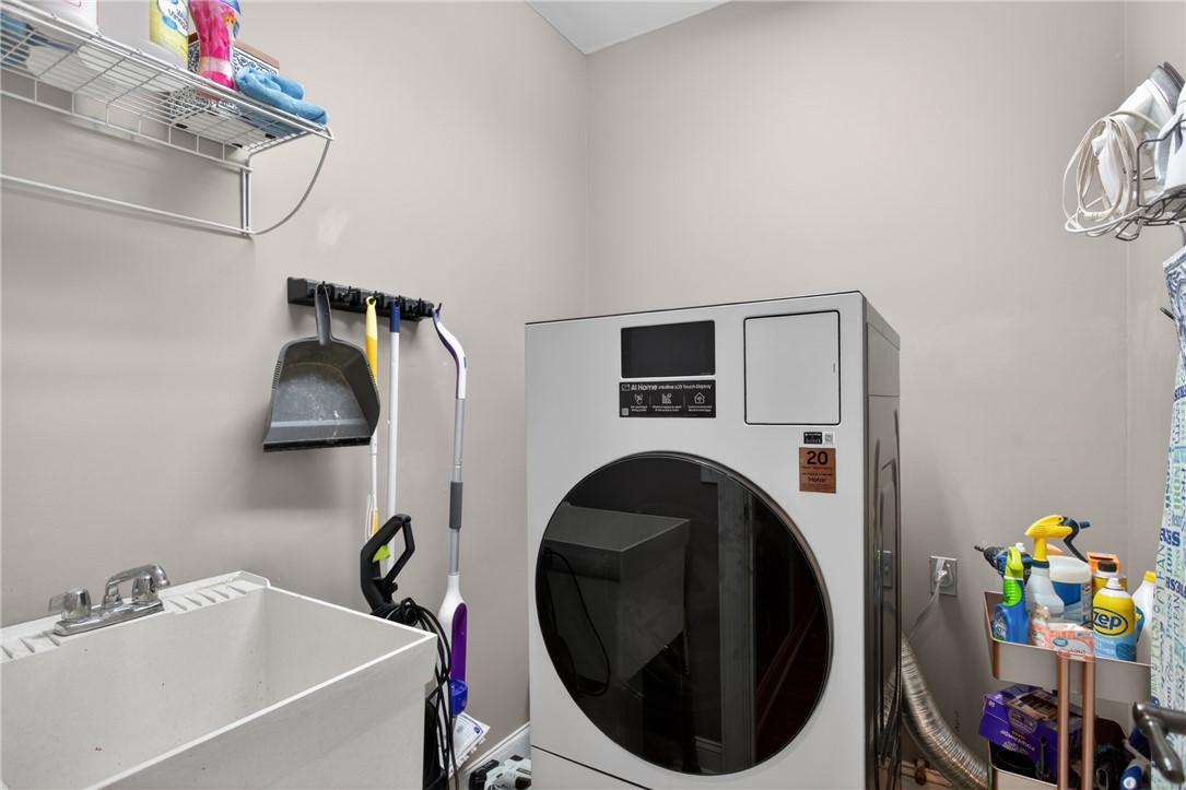136 Loran Pointe Circle Seneca, SC 29672 - Photo 16 of 50 A well-organized laundry room features a utility sink and essential appliances for efficient household chores.