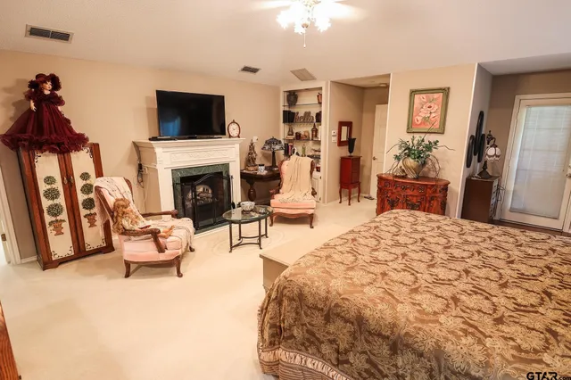 a kids bedroom with a bed next to a window