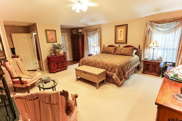 a view of a patio with chairs and plants
