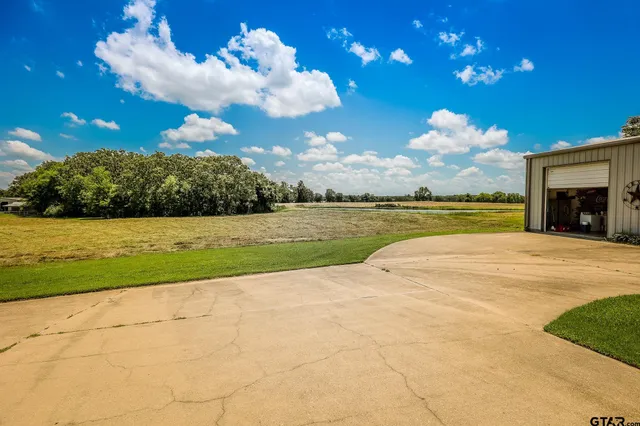 a view of a golf course with a lake