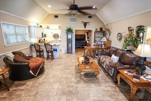 a kitchen with a sink appliances and cabinets