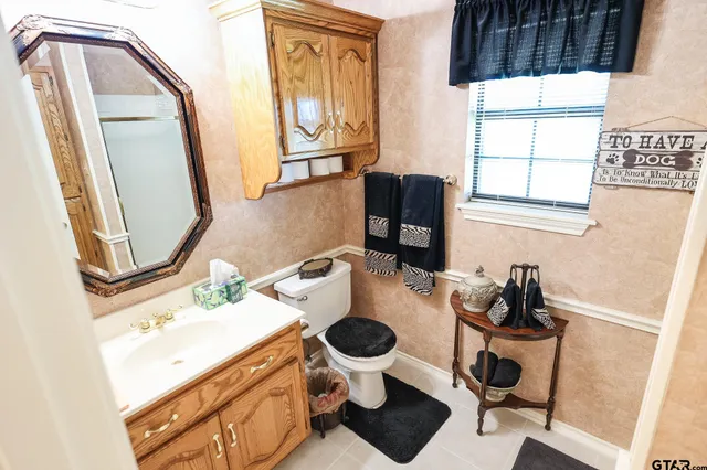 a kitchen with stainless steel appliances kitchen island granite countertop a refrigerator and a stove top oven