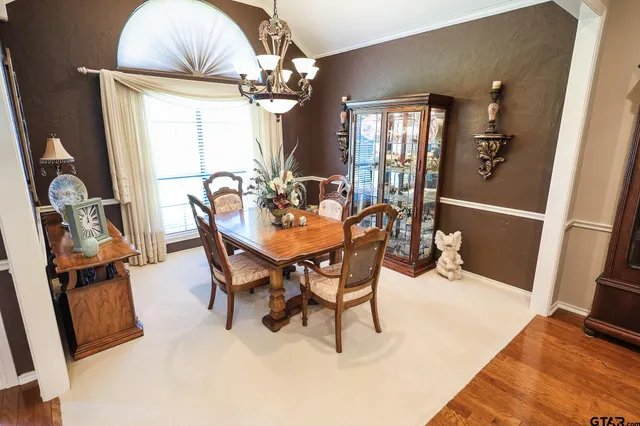 a kitchen with a refrigerator and a stove top oven