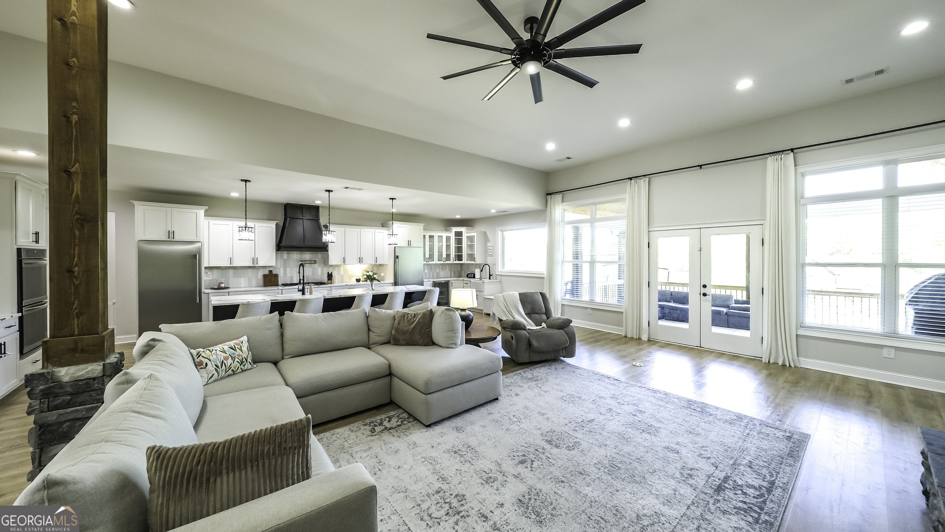 2392 Welcome Road Roopville, GA 30170 - Photo 17 of 43 a living room with furniture and a large window