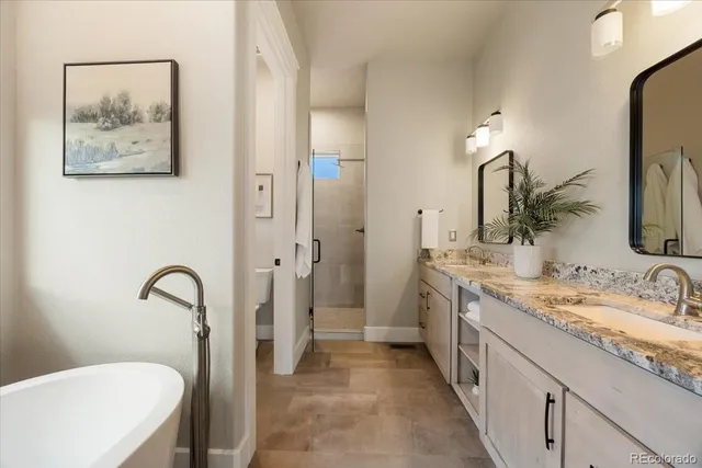a spacious bathroom with a sink and a mirror