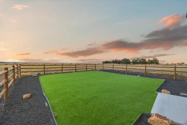 a view of a golf course with a garden