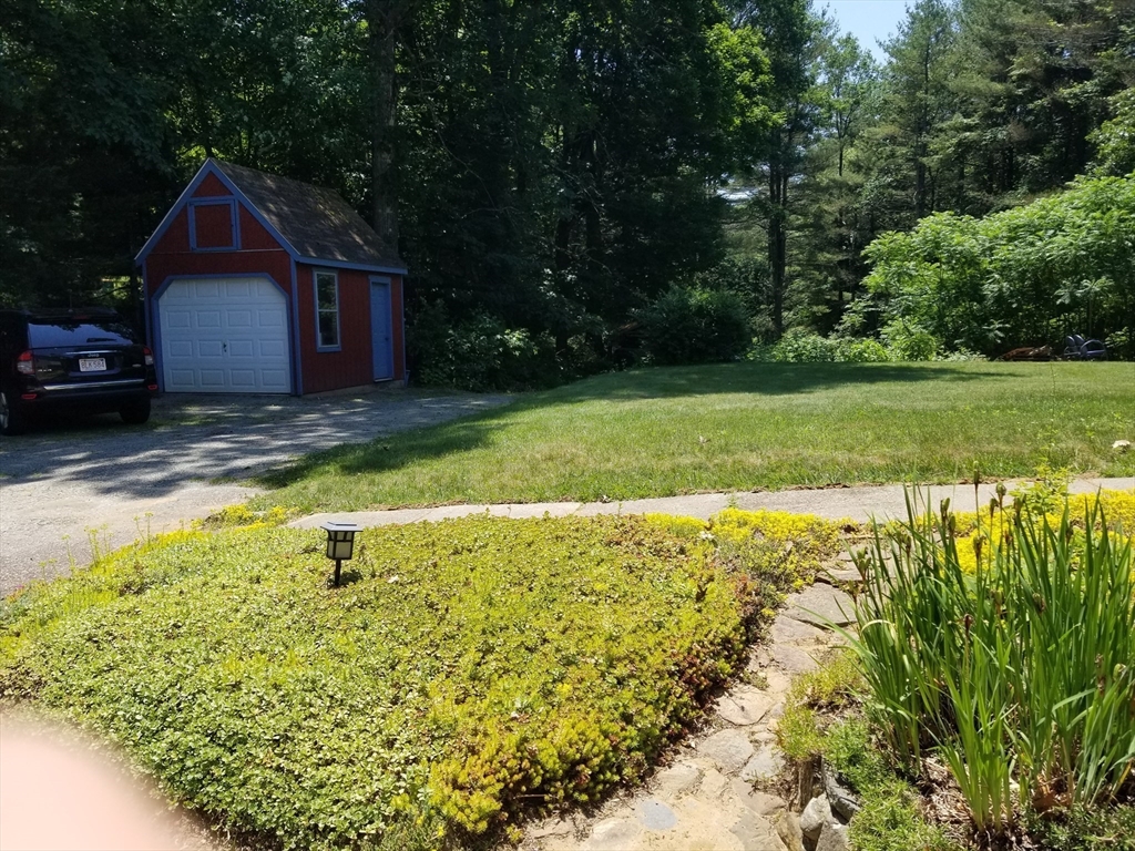 291 Crouch Road Warren, MA 01092 - Photo 9 of 29 a view of a backyard with swimming pool