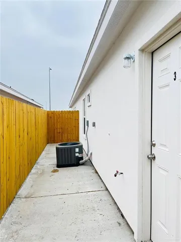 a living room with a couch and a ceiling fan