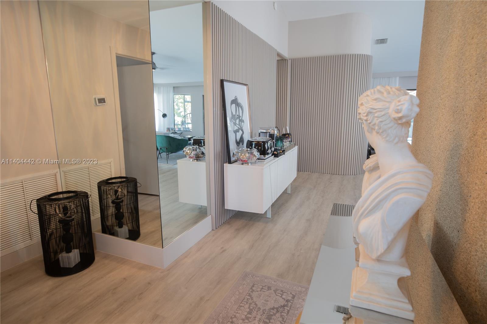 10684 Santa Laguna Drive Boca Raton, FL 33428 - Photo 13 of 39 a view of a hallway with seating area