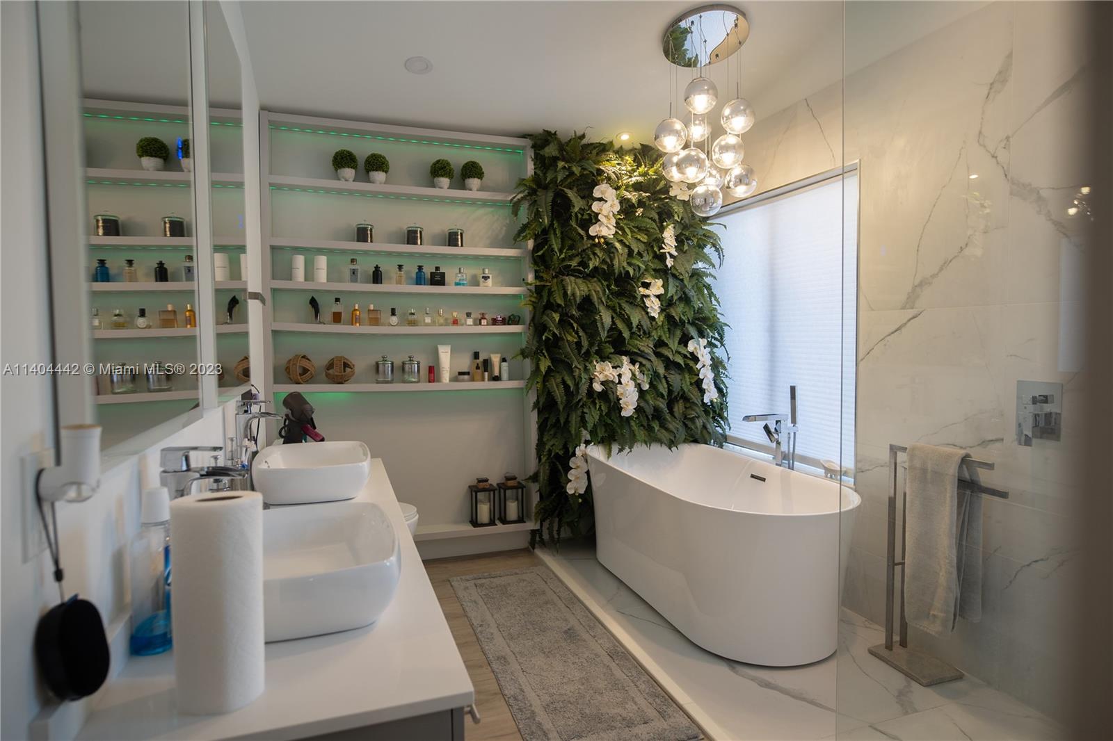 10684 Santa Laguna Drive Boca Raton, FL 33428 - Photo 19 of 39 a bathroom with a bathtub a sink and a shower