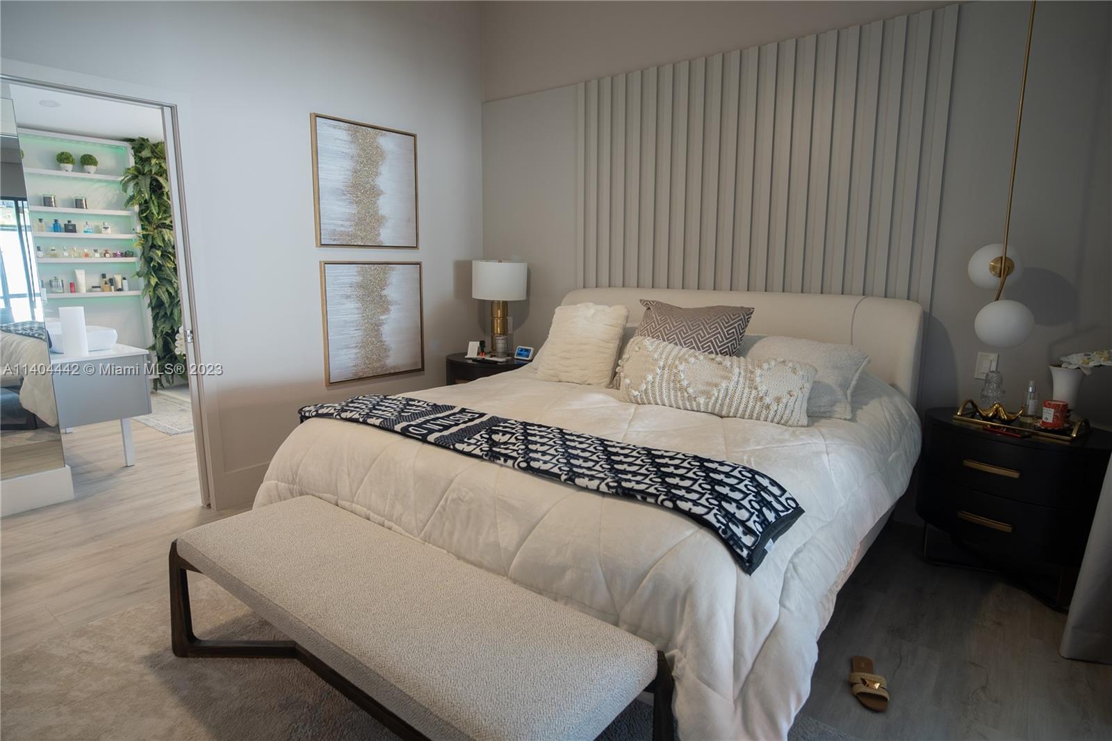 10684 Santa Laguna Drive Boca Raton, FL 33428 - Photo 23 of 39 a bedroom with a bed and a lamp