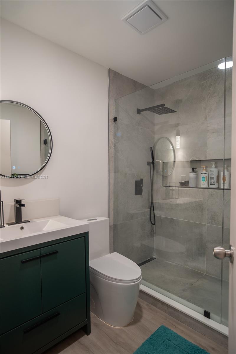 10684 Santa Laguna Drive Boca Raton, FL 33428 - Photo 26 of 39 a bathroom with a sink toilet and shower