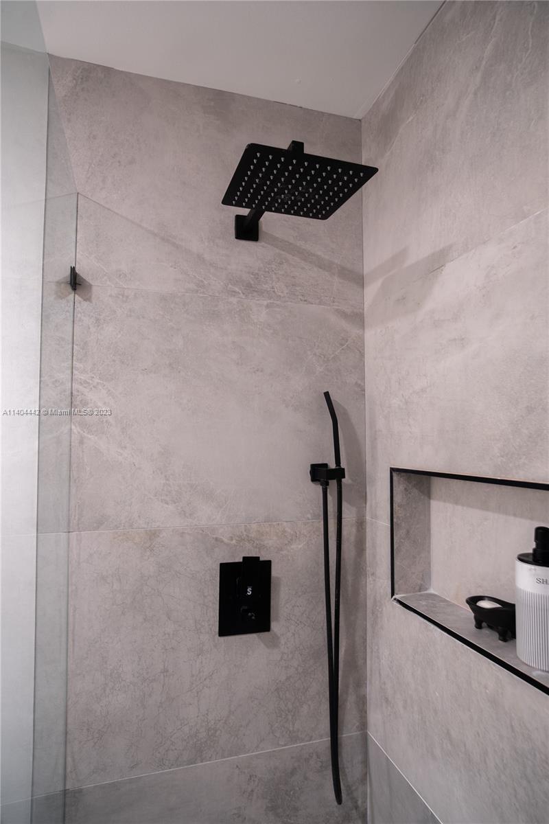 10684 Santa Laguna Drive Boca Raton, FL 33428 - Photo 28 of 39 a bathroom with a shower and a sink
