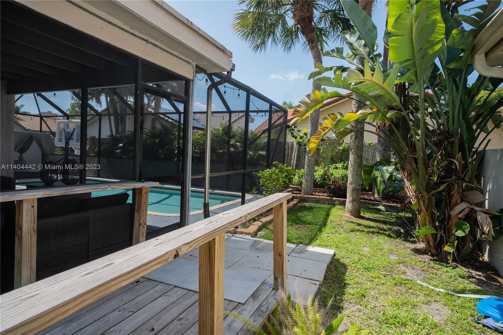10684 Santa Laguna Drive Boca Raton, FL 33428 - Photo 36 of 39 a view of swimming pool with a patio and a yard