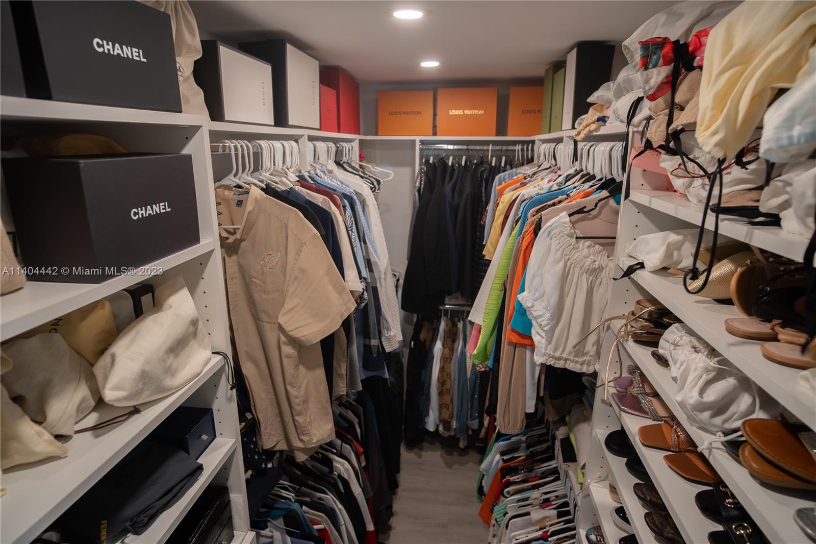 10684 Santa Laguna Drive Boca Raton, FL 33428 - Photo 38 of 39 a view of walk in closet with clothes and shoes
