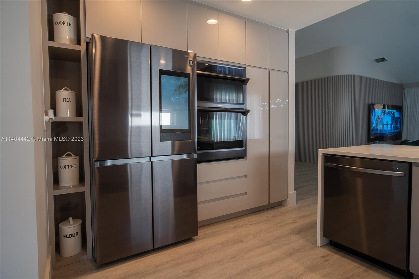 10684 Santa Laguna Drive Boca Raton, FL 33428 - Photo 5 of 39 a kitchen with a refrigerator and a sink