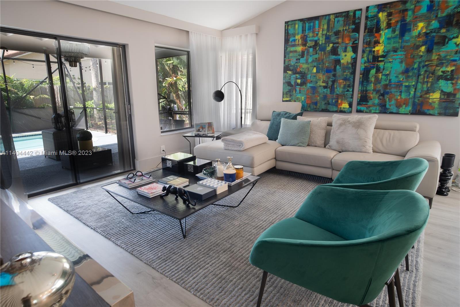 10684 Santa Laguna Drive Boca Raton, FL 33428 - Photo 10 of 39 a living room with furniture and a large window