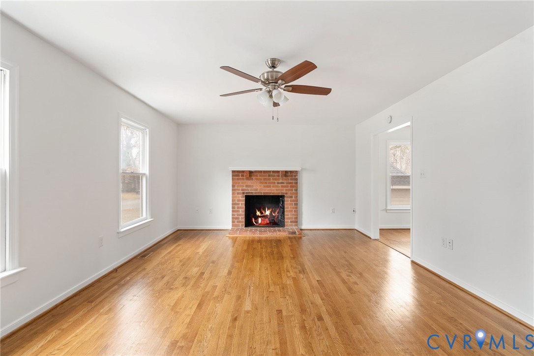 5609 Chatmoss Road Midlothian, VA 23112 - Photo 5 of 28 a view of an empty room with a window and fireplace