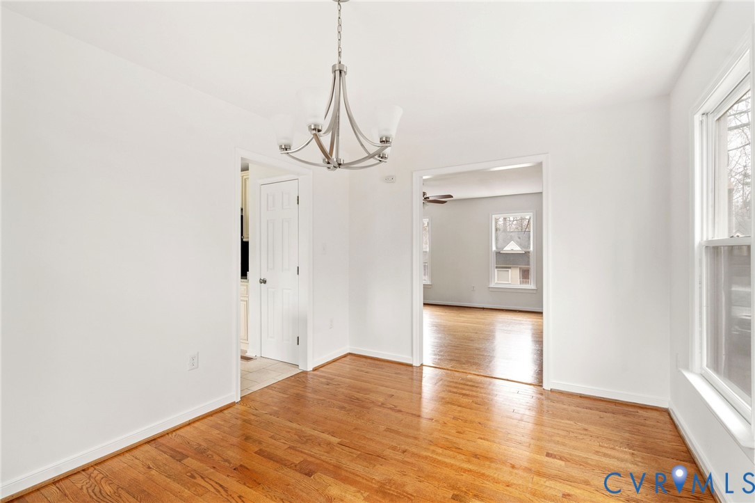 5609 Chatmoss Road Midlothian, VA 23112 - Photo 7 of 28 a view of empty room with wooden floor and windows