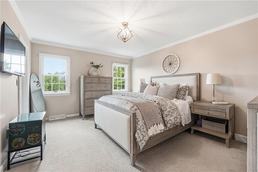 267 Forsythe Road Mars, PA 16046 - Photo 22 of 41 a bed room with a bed and a chandelier