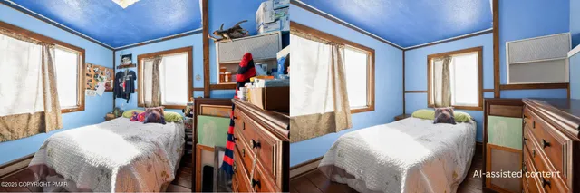 a bedroom with furniture and a large window