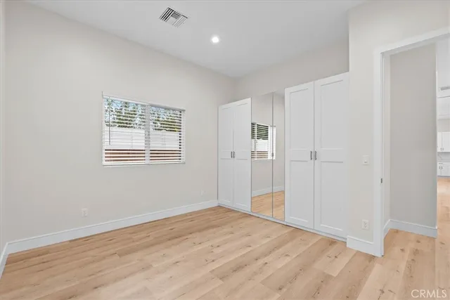 a kitchen with a refrigerator stove top oven and sink