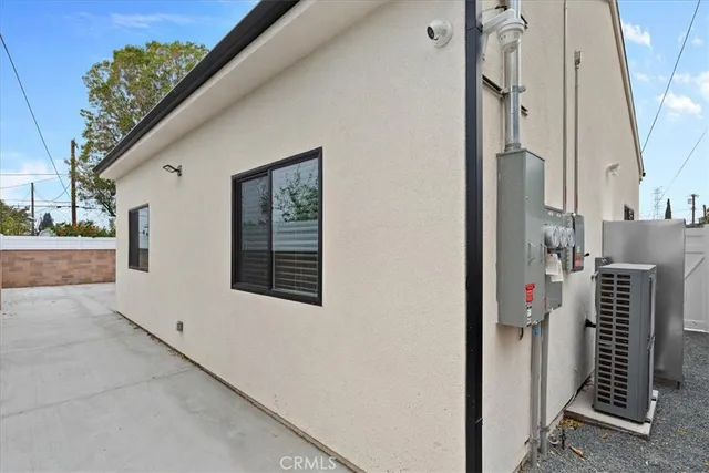 a view of a house with a backyard and balcony