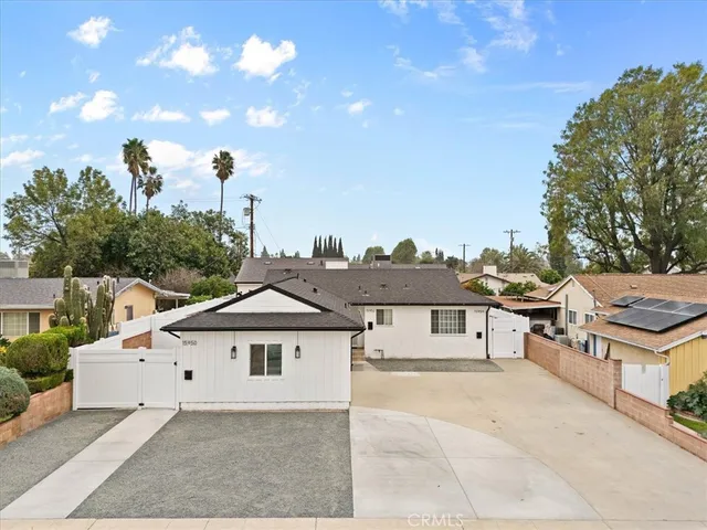 an aerial view of a house with a garden and plants