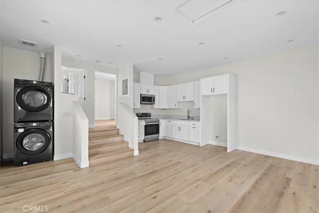 a bathroom with a shower sink and toilet