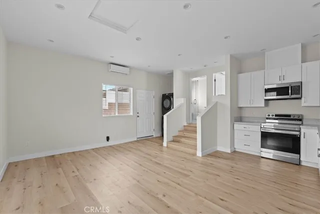 a kitchen with a stove a sink and a refrigerator