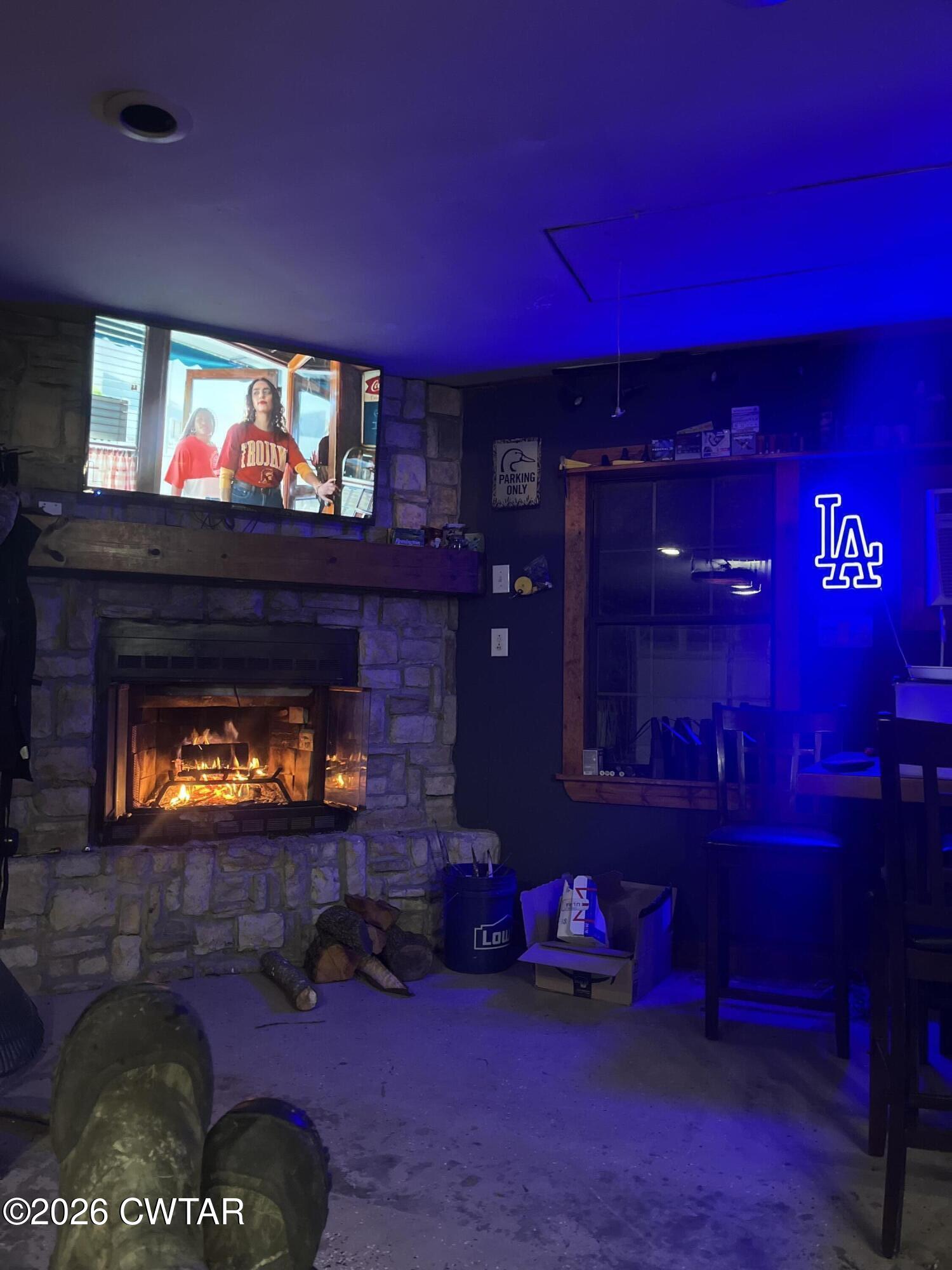 235 Tate Road Dyersburg, TN 38024 - Photo 12 of 34 a living room with furniture and a fireplace