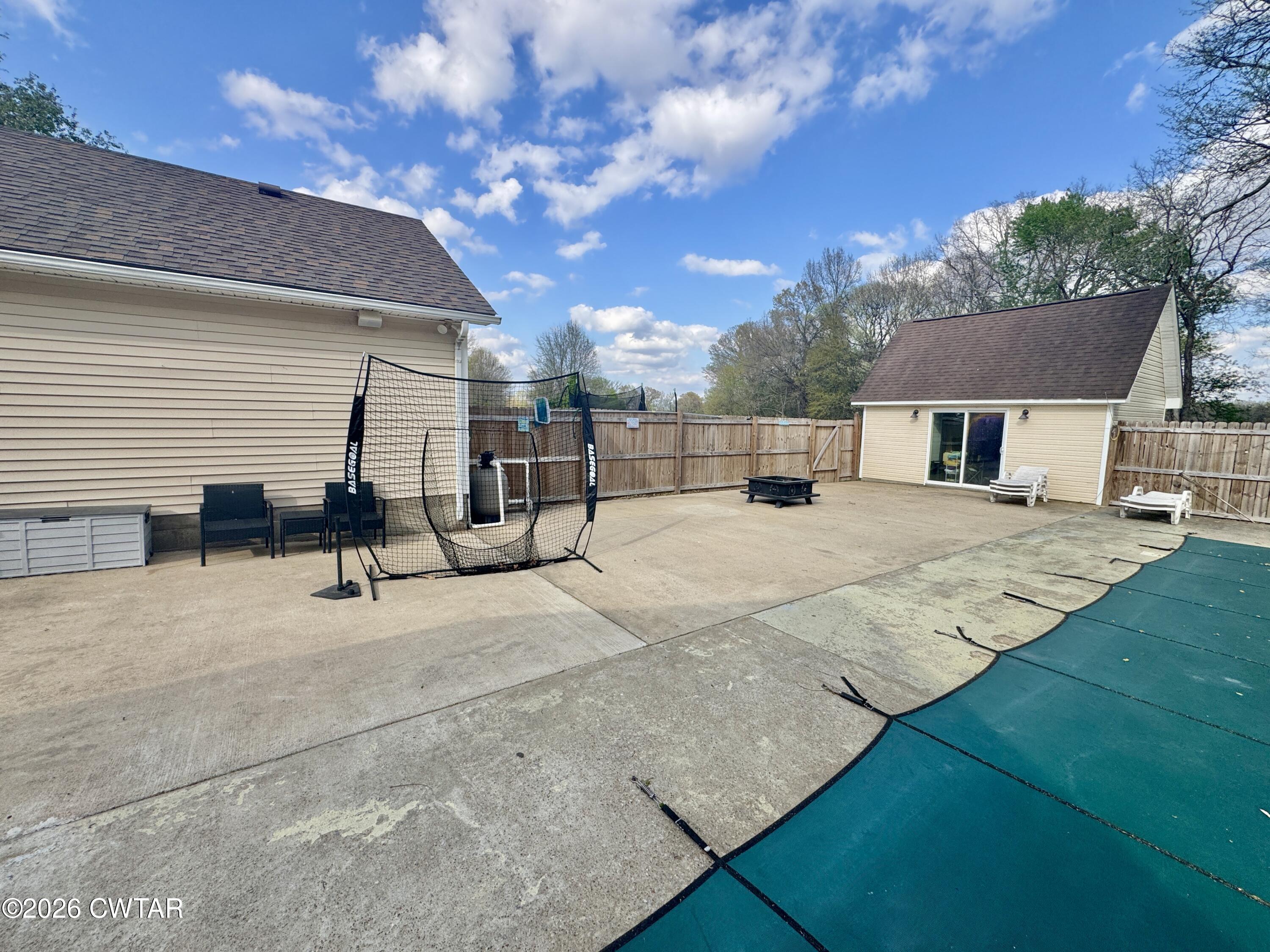 235 Tate Road Dyersburg, TN 38024 - Photo 14 of 34 a view of a house with a patio