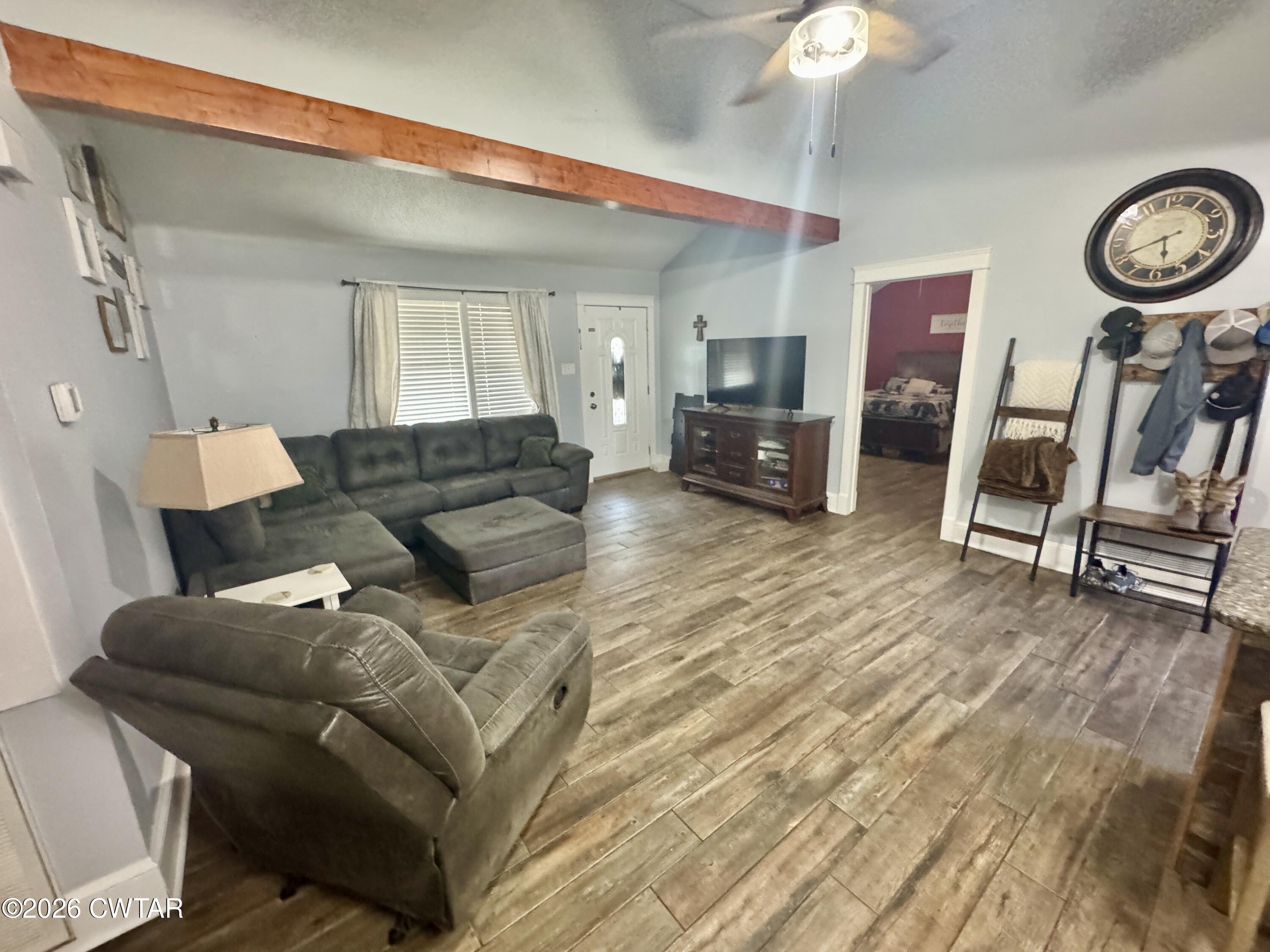 235 Tate Road Dyersburg, TN 38024 - Photo 22 of 34 a living room with furniture and a wooden floor